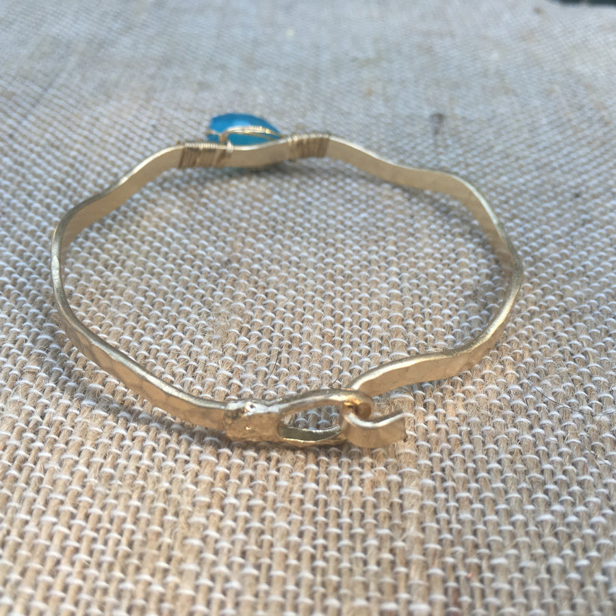 Worn Gold Tone Wavy Latch Bangle with Stone- Blue