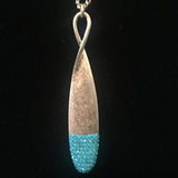 Burnished Gold Tone Necklace with Teardrop Rhinestone Pendant- Aqua
