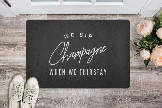 We Sip Champagne Welcome Mat-Black/White