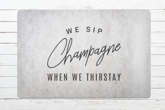 We Sip Champagne Welcome Mat-Stone/Black