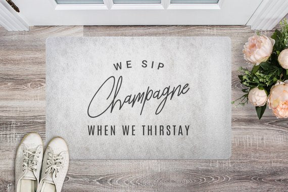 We Sip Champagne Welcome Mat-Stone/Black