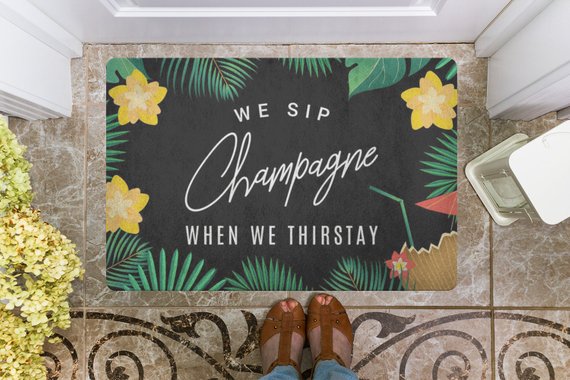 We Sip Champagne Welcome Mat-Tropical/Black